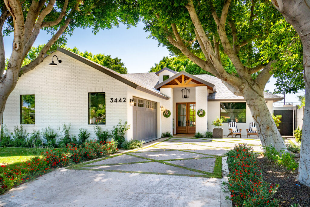 Increasing curb appeal of home southwest florida, fort myers, naples, bonita springs. A Fort Myers home with clean siding, roof, and driveway after professional exterior cleaning.