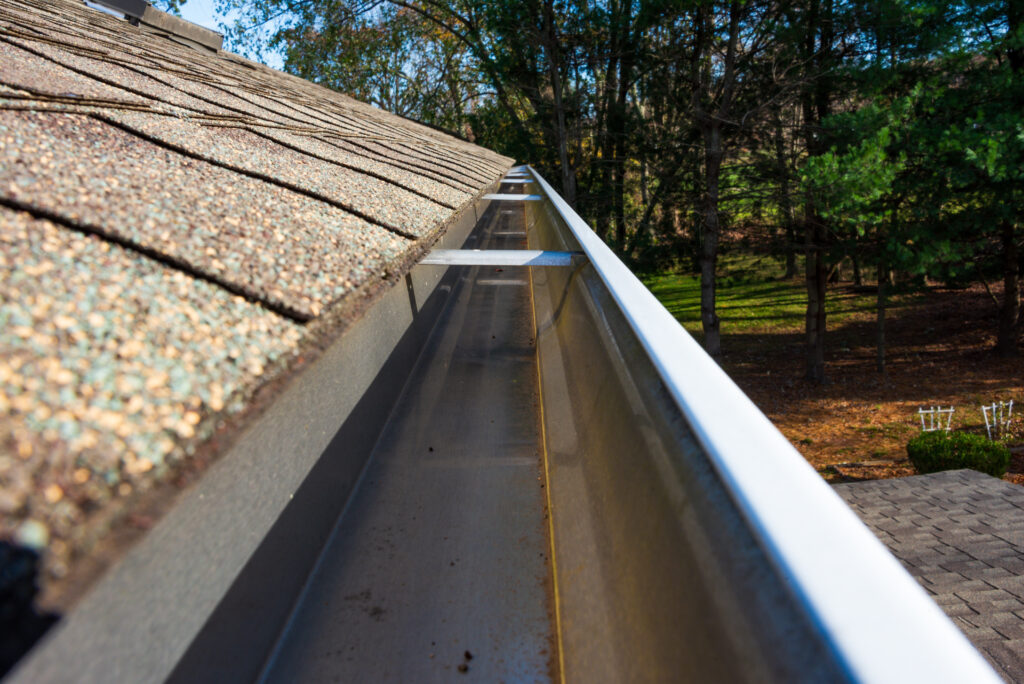 Soft-washed gutters and siding after professional cleaning in Fort Myers.